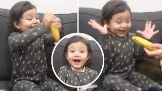 This little girl was so excited to be given a banana for Christmas