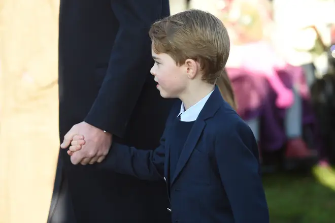 Prince George was dressed in a navy suit as he held his father's hand