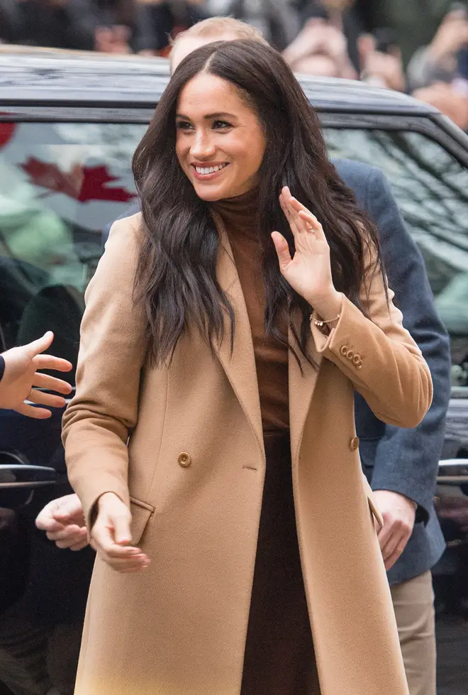 The Duchess of Sussex looked amazing in a brown skirt and jumper, teamed with a camel coat