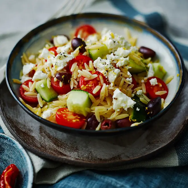 Greek salad gets a twist with the addition of tiny pieces of pasta
