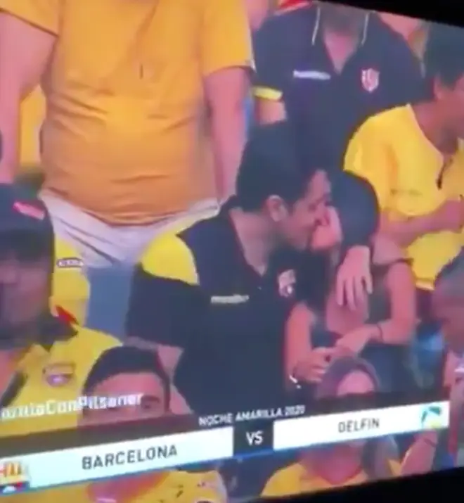 One man really put is foot in it when he shared a passionate kiss with his date during a football game's kiss cam segment