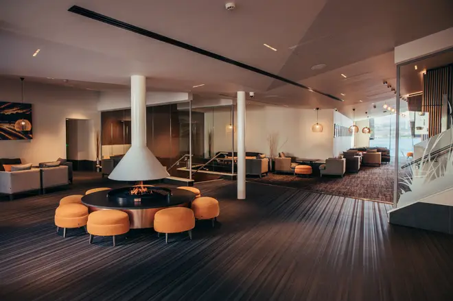 The lobby of the hotel features a Scandinavian style open fireplace