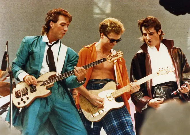 Martin and Gary Kemp with Tony Hadley performing at Live Aid in 1984