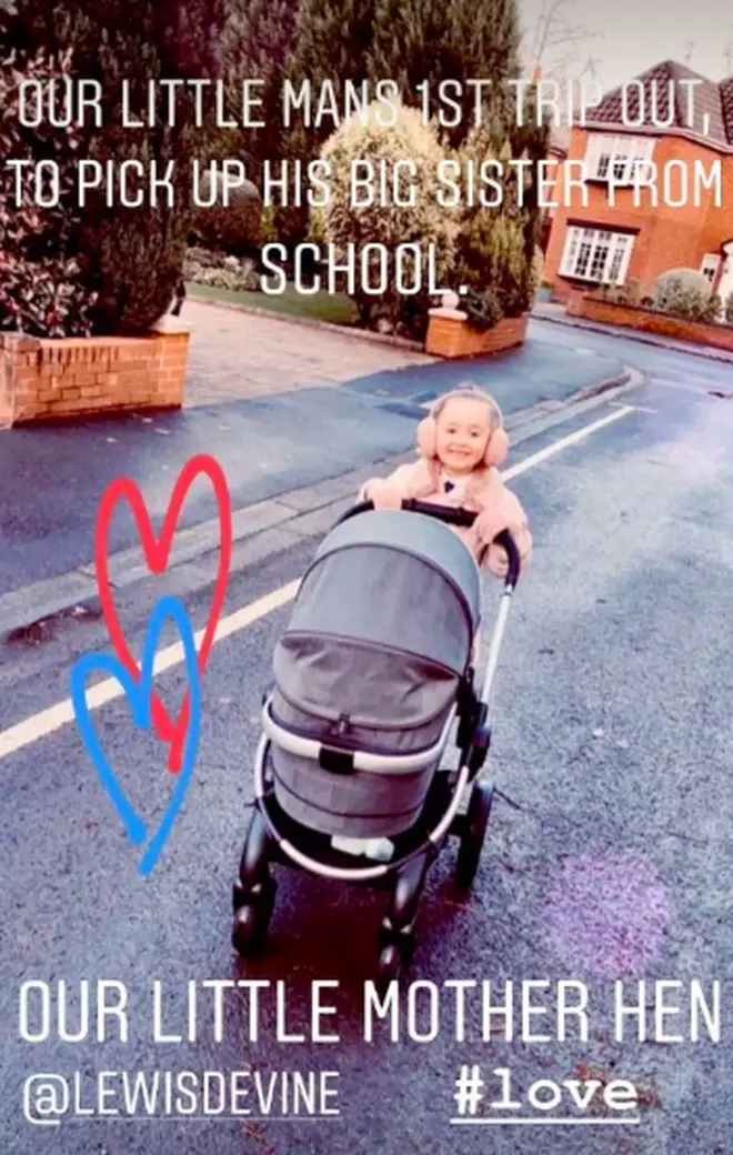 Sienna pushes her little brother in his buggy