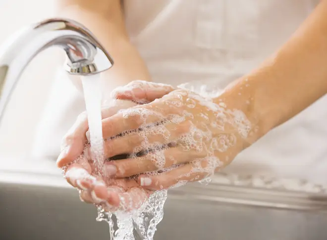 You should ideally be washing your hands with hot water and soap