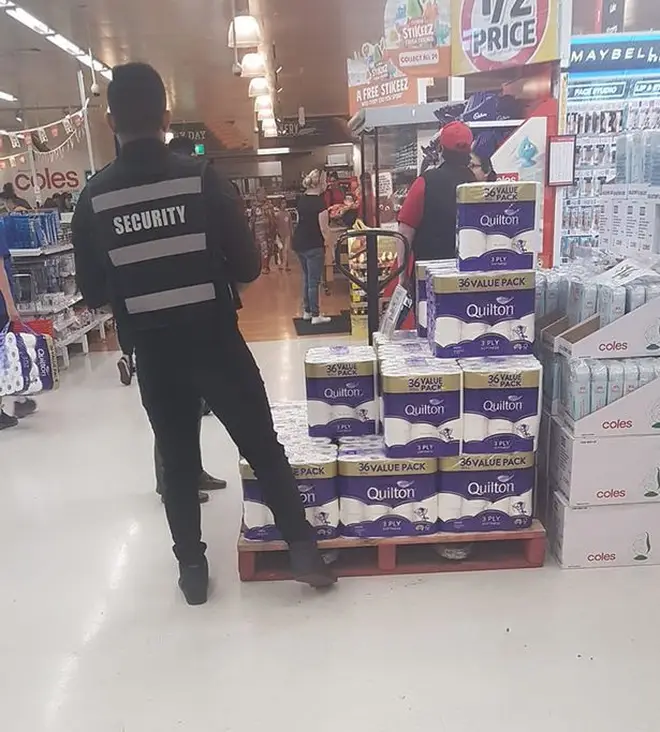 One supermarket has security staff guarding the toilet paper