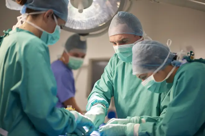 NHS surgeons in their hospital scrubs (file photo)