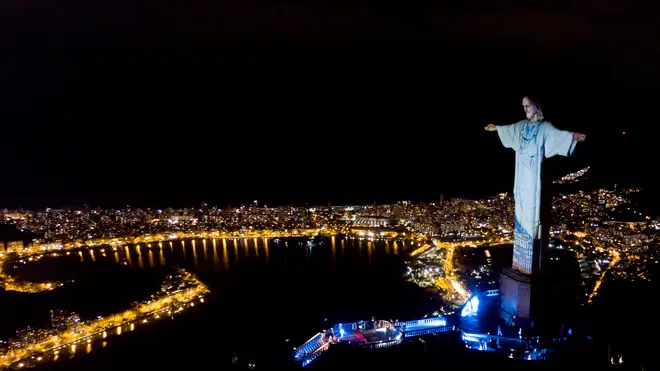 Christ the Redeemer was lit up to wear a doctors uniform as the words 'thank-you' and 'hope' were spelled over the clothing
