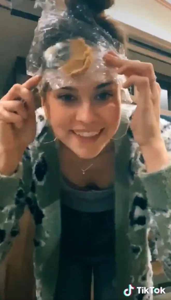 Lindsey's video starts off with her rubbing peanut butter on her head