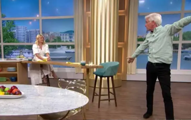 Holly couldn't stop laughing as Phil did the yoga moves
