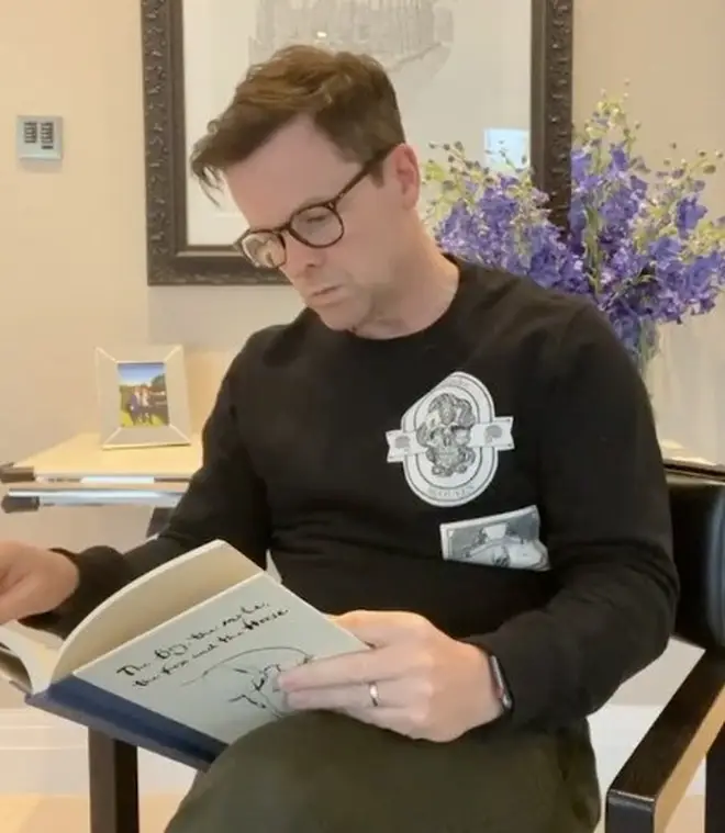 The video started with Dec reading a book