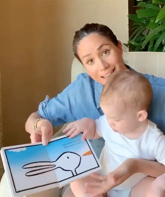 Baby Archie looked delighted as Meghan Markle read him a new book