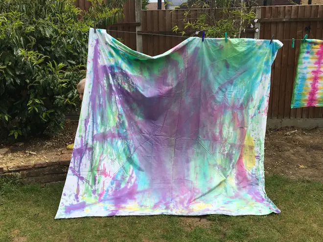 We 'experimented' by squirting dye at random over a double duvet cover - when it was washed and dried, it had a beautiful, ombre finish (pictured here pre-wash)