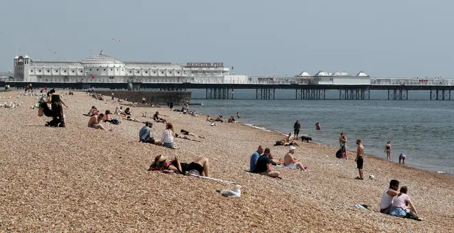 People in England are now able to sit in the sun under new lockdown guidance