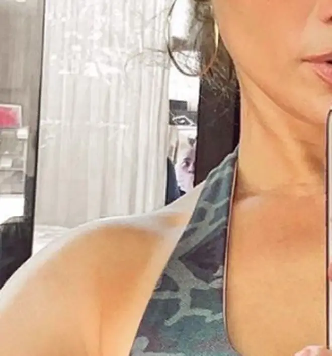 Fans spotted what appeared to be a man in a mask behind J.Lo