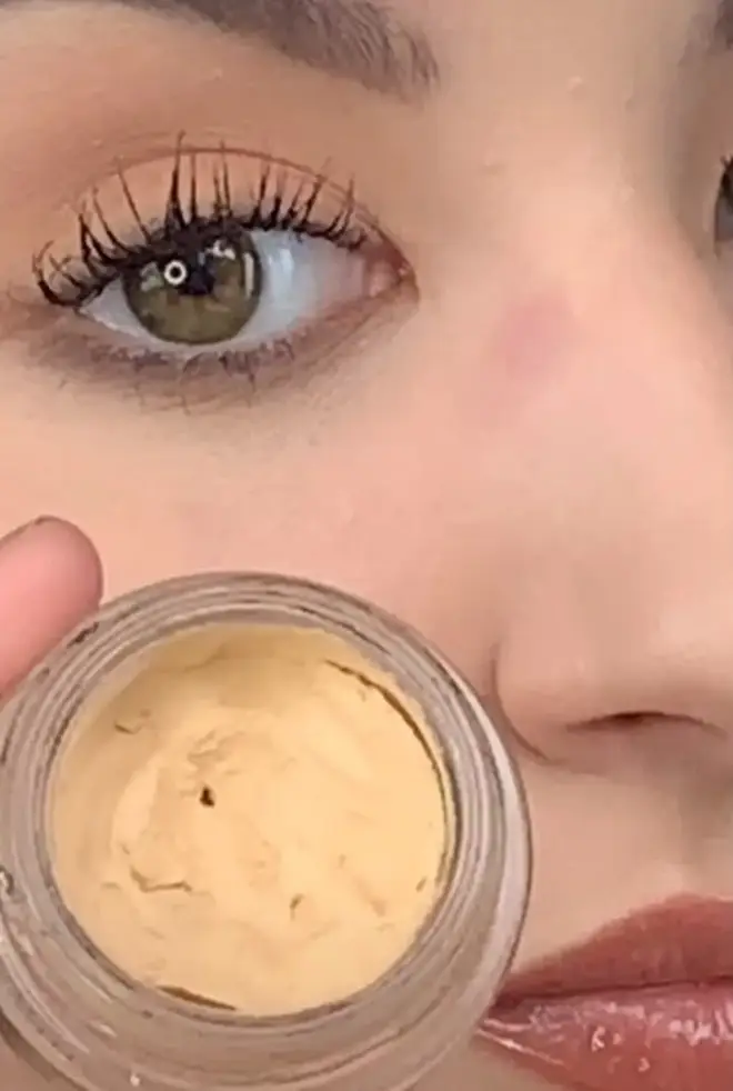 Ellie pops on a concealer-coloured eyelid primer on her nose