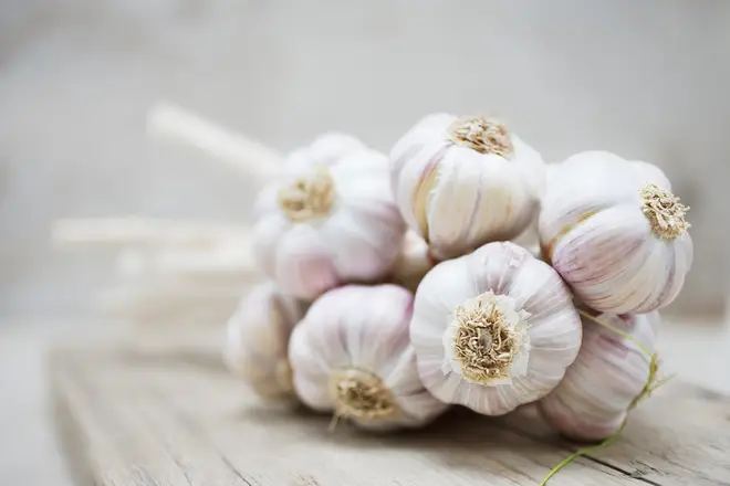 Putting garlic in hot water will allow the skins to 'slip off'