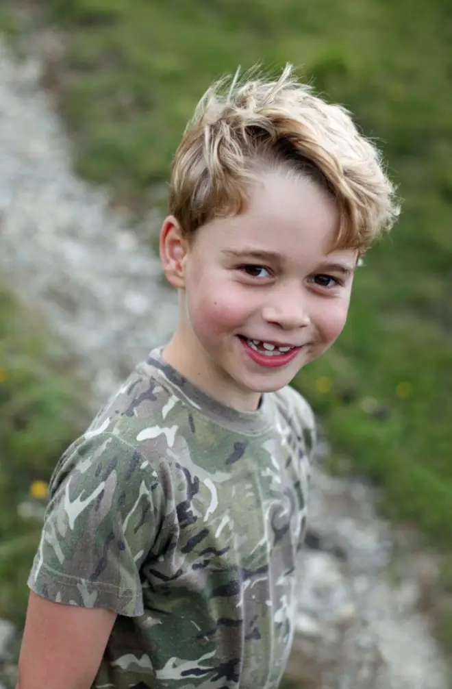 Prince George showed off his cheeky grin in the new pictures, taken by Kate Middleton