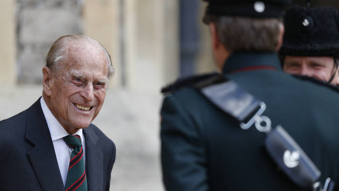 The Duke of Edinburgh smiled as he spoke to the assistant colonel