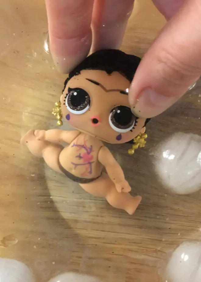 Parents have been dipping the dolls in ice water to reveal the hidden outfits