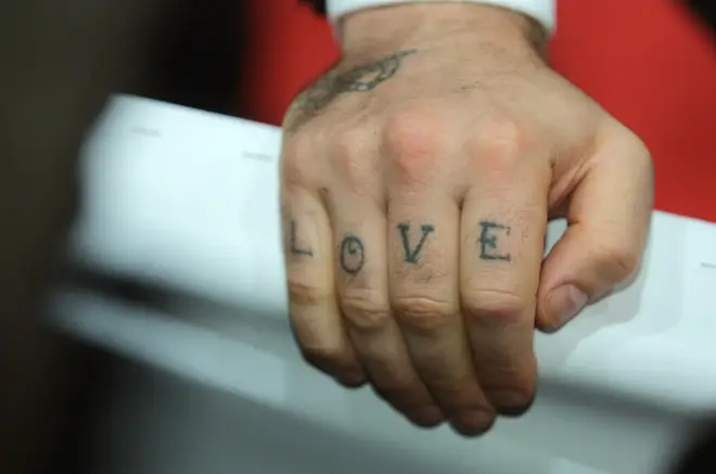 Robbie's 'LOVE' tattoo