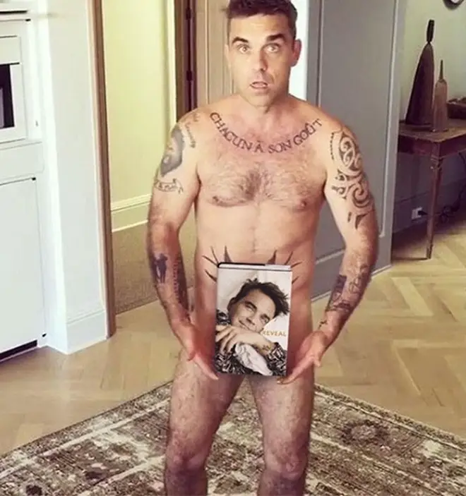 Robbie is fond of showing off his tattoos