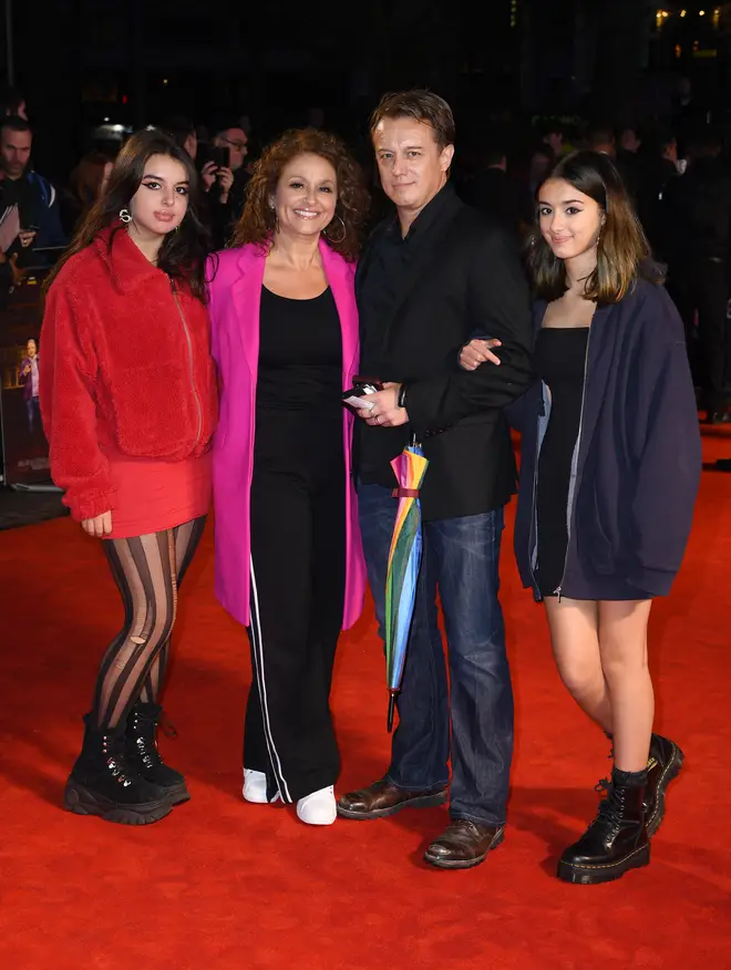 Nadia and husband Mark Adderley with their daughters