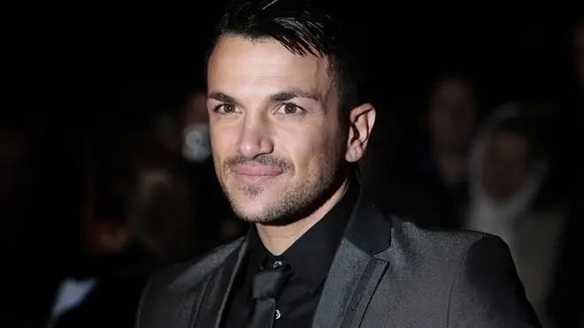 Peter Andre wears smart black suit on the red carpet as he announces tour