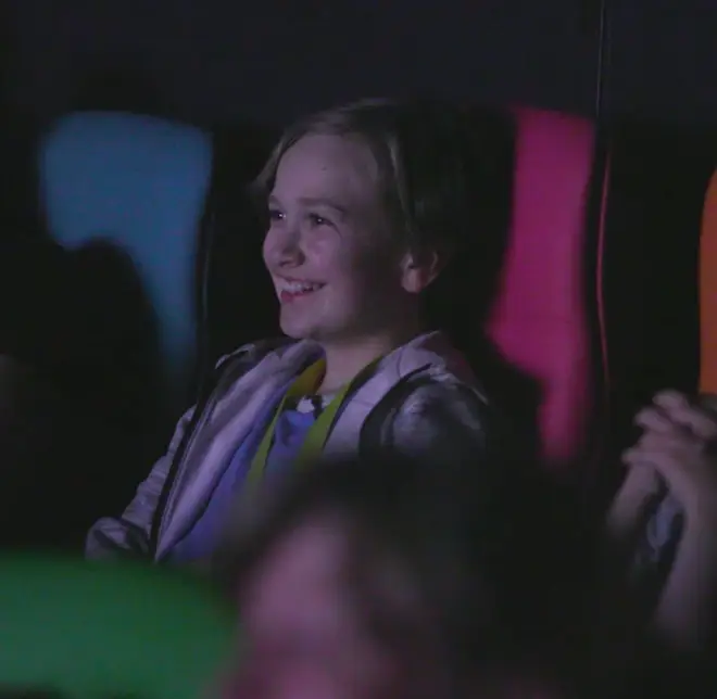 Darach beams as he watches a film at the Glasgow MediCinema