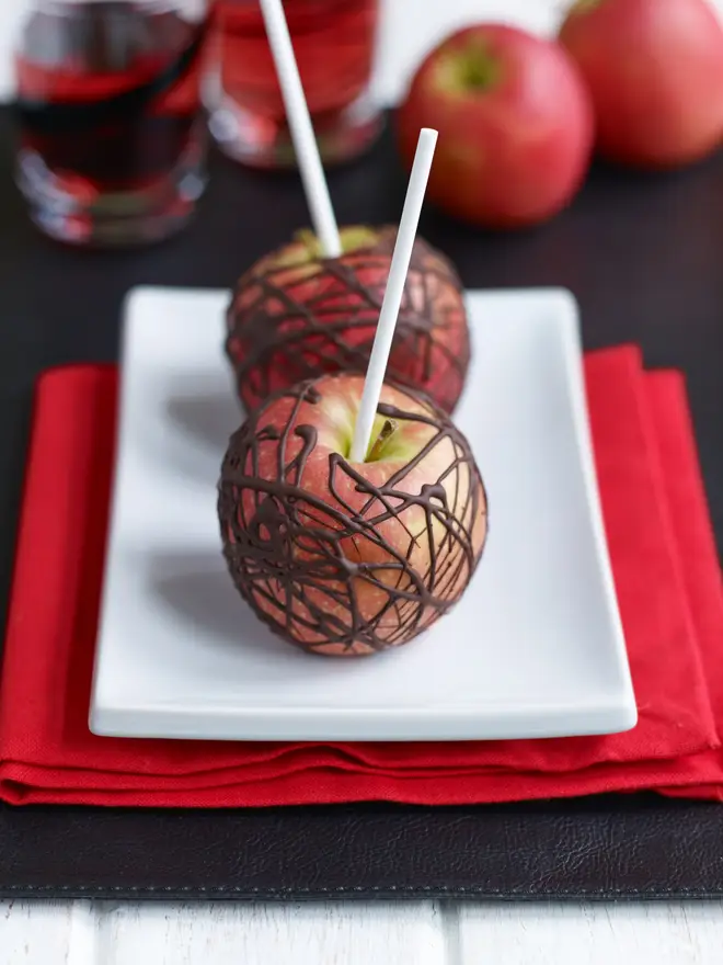 These chocolate apples are a tasty twist on a toffee apple