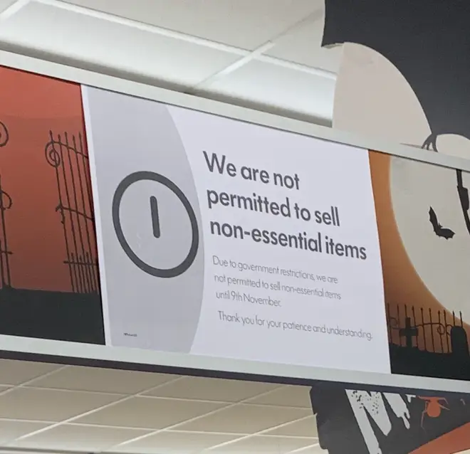 Sign on non-essential items at a supermarket in Wales