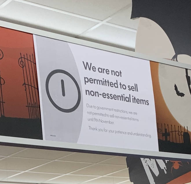 Sign on non-essential items at a supermarket in Wales