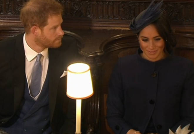 Prince Harry and Meghan Markle take their seats in St George's Chapel