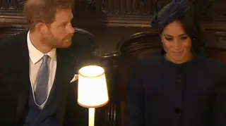 Prince Harry and Meghan Markle take their seats in St George's Chapel