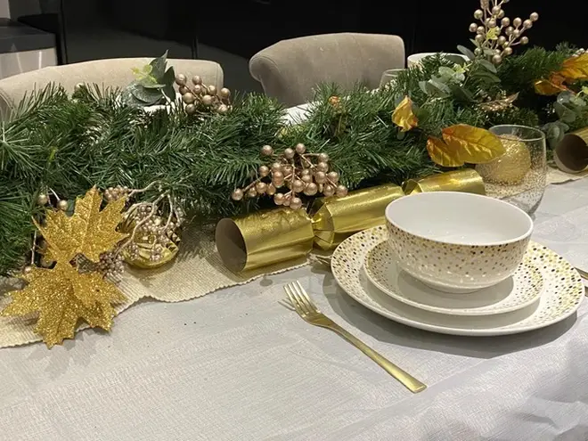 Fia opted for gold and green hues for her Christmas table