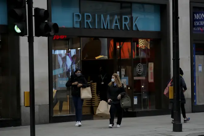 Two people leaving Primark on Oxford Street, London