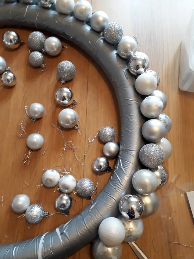 Use smaller baubles to fill any gaps and make it look full