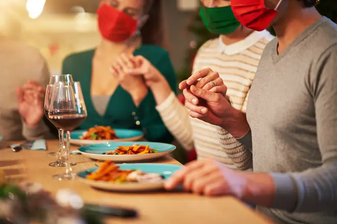 The WHO has advised keeping masks on over Christmas dinner