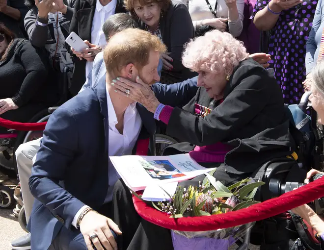 Prince Harry embraces his 92-year-old fan
