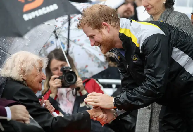 Daphne braved the rain in 2017 for a cuddle with Prince Harry