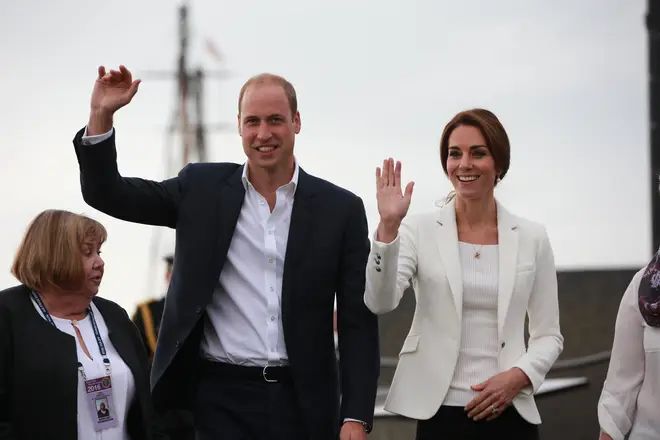 Kate Middleton and Prince William wave on a royal tour