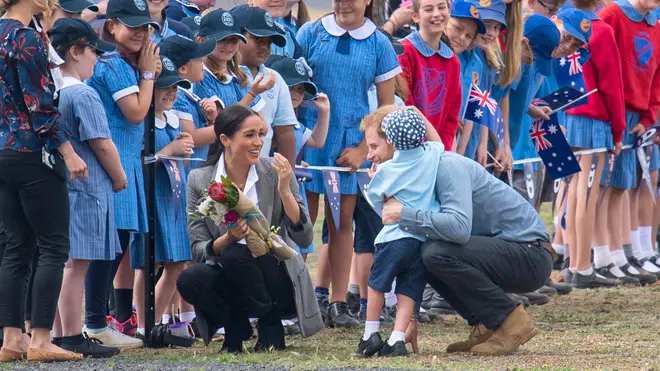 The Duke of Sussex hugs boy as he and Meghan Markle make royal tour to Australia