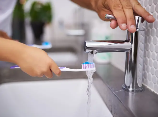 You should ensure to rinse your toothbrush under the tap after brushing (stock image)