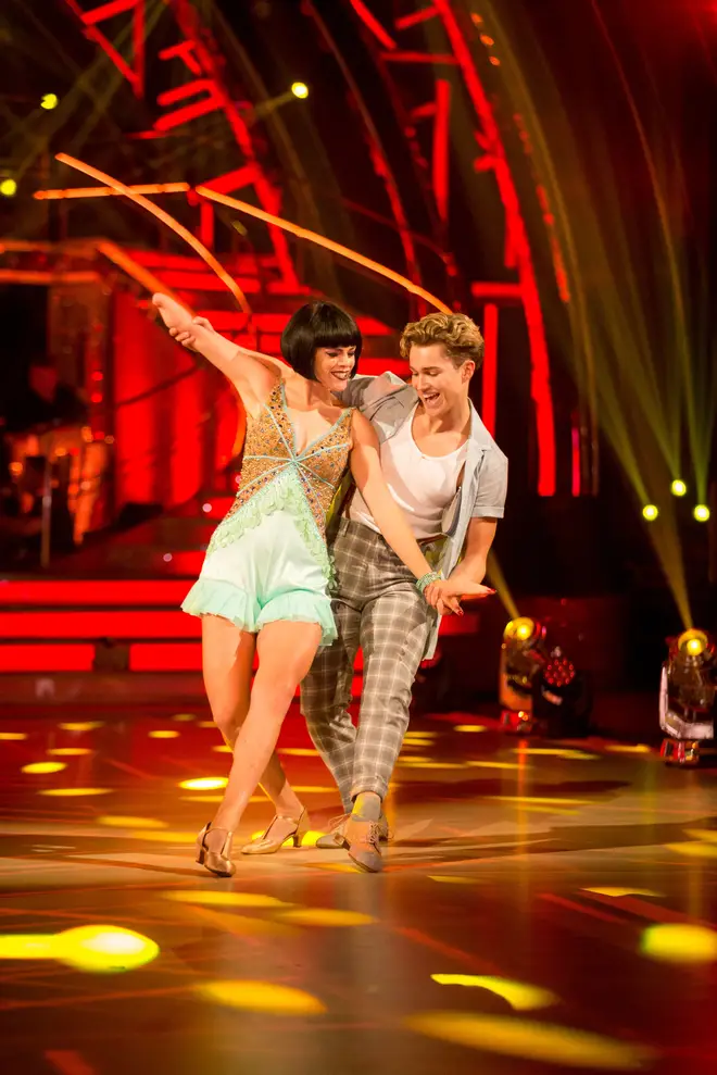 Lauren Steadman dances with AJ Pritchard in a green dress and short black wig