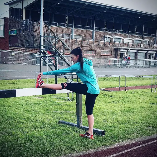 Lauren Steadman stretches her muscles on the athletics track