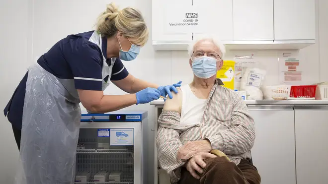 Peter Cast, 87, from Ashtead, receives the vaccine at Superdrug in Guildford