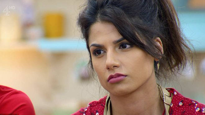 Ruby Bhogal wears a red shirt on Bake Off