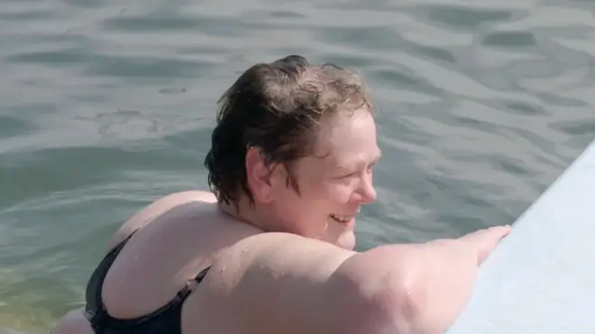Anne Hegerty is seen taking a drip in the ocean in the clip