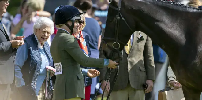 The Queen meets one of her racehorses at Windsor Castle in May 2018