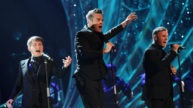 Robbie Williams on stage with Take That in 2011
